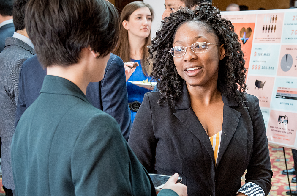 Two students during a poster session.